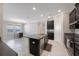 Modern kitchen with stainless steel appliances, granite countertops, a kitchen island, and tile flooring at 13213 Haystack Ct, Riverview, FL 33579