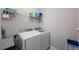 Laundry room with a modern washer and dryer set and ample space for laundry accessories at 13213 Haystack Ct, Riverview, FL 33579