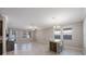 Bright and airy living room with tiled floors, neutral walls, natural light, and a dining area at 13213 Haystack Ct, Riverview, FL 33579