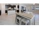 Spacious living room open to the kitchen, featuring modern tile floors, and a dining area at 13213 Haystack Ct, Riverview, FL 33579