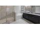 Bathroom featuring double sinks, a shower, and a bathtub at 13213 Haystack Ct, Riverview, FL 33579