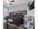 Home office with custom built-in shelving and desk, plus natural light and room for multiple monitors at 13213 Haystack Ct, Riverview, FL 33579