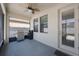 Screened patio with ceiling fan, featuring a grill for outdoor cooking and entertaining at 13213 Haystack Ct, Riverview, FL 33579