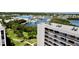 High-rise condo living with scenic views of the marina and green lawns, featuring well-maintained landscaping at 1332 Pasadena S Ave # 208, South Pasadena, FL 33707