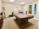 The game room has a pool table and seating for residents to enjoy at 1332 Pasadena S Ave # 208, South Pasadena, FL 33707