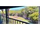 Relax on the screened lanai with views of the tropical landscape and distant water at 1332 Pasadena S Ave # 208, South Pasadena, FL 33707