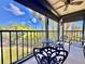 Enjoy the beautiful view from this screened lanai with lovely outdoor seating at 1332 Pasadena S Ave # 208, South Pasadena, FL 33707
