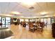 A community seating area has large windows and plenty of tables and chairs at 1332 Pasadena S Ave # 208, South Pasadena, FL 33707