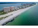 Breathtaking aerial view of beachfront condos along a stunning coastline with crystal-clear waters at 1340 Gulf Blvd # 16A, Clearwater Beach, FL 33767