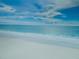 A beautiful view of the beach with white sand and blue water at 1340 Gulf Blvd # 16A, Clearwater Beach, FL 33767