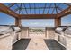 Outdoor grilling area with granite countertops and views of the ocean at 1340 Gulf Blvd # 16A, Clearwater Beach, FL 33767