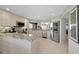 Open kitchen with stainless steel appliances and stone countertops at 1340 Gulf Blvd # 16A, Clearwater Beach, FL 33767