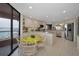 Bright kitchen with stainless steel appliances, granite countertops, island, and a breakfast nook overlooking the water at 1340 Gulf Blvd # 16A, Clearwater Beach, FL 33767