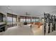 Bright and spacious living room featuring floor-to-ceiling windows with stunning ocean views and a grand white piano at 1340 Gulf Blvd # 16A, Clearwater Beach, FL 33767