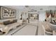 The open floor plan features a living room with a couch and a view into the kitchen at 1340 Gulf Blvd # 16A, Clearwater Beach, FL 33767