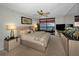 Bright main bedroom with balcony access, a ceiling fan, carpeted floor, and modern furniture at 1340 Gulf Blvd # 16A, Clearwater Beach, FL 33767