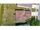 Aerial view of roof showing architectural style and surrounding landscaping at 14137 Wake Robin Dr, Brooksville, FL 34604