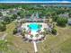 Aerial view of community pool, playground, clubhouse, and common areas at 14137 Wake Robin Dr, Brooksville, FL 34604