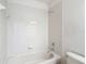 Bathroom features a tub with tile surround at 14137 Wake Robin Dr, Brooksville, FL 34604