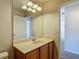 View of the bathroom featuring vanity, mirror, and view into bedroom at 14137 Wake Robin Dr, Brooksville, FL 34604