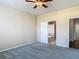 Neutral bedroom featuring soft carpet and attached bathroom with tub, offering convenience and privacy at 14137 Wake Robin Dr, Brooksville, FL 34604