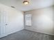 Bedroom has plush carpet, neutral paint and a window for natural light at 14137 Wake Robin Dr, Brooksville, FL 34604