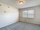 Bedroom with neutral walls, carpeted floor, and natural light from window at 14137 Wake Robin Dr, Brooksville, FL 34604
