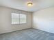 Bedroom features plush carpet, a window and neutral paint at 14137 Wake Robin Dr, Brooksville, FL 34604