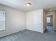 Bedroom with carpet and natural light; door opens to hallway at 14137 Wake Robin Dr, Brooksville, FL 34604