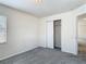 Bedroom with plush gray carpet, closet with sliding doors, and neutral paint at 14137 Wake Robin Dr, Brooksville, FL 34604