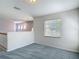 Bright bedroom featuring plush carpet and natural light from a large window at 14137 Wake Robin Dr, Brooksville, FL 34604