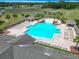 Overhead shot of community pool with ample seating and relaxation spaces at 14137 Wake Robin Dr, Brooksville, FL 34604