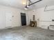 A spacious garage featuring a door to the house and room for storage at 14137 Wake Robin Dr, Brooksville, FL 34604