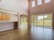 Bright, open living room with high ceilings and sliding glass doors to the backyard at 14137 Wake Robin Dr, Brooksville, FL 34604