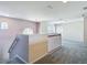 Loft with carpet, railing, and natural light from multiple windows creates a welcoming space at 14137 Wake Robin Dr, Brooksville, FL 34604