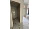 Stylish bathroom featuring new marble floors and walls, and modern fixtures at 14273 Nugent Circle, Spring Hill, FL 34609