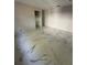 Spacious bedroom with marble-style flooring, ample natural light, and closet space, under construction at 14273 Nugent Circle, Spring Hill, FL 34609