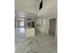 Spacious kitchen with white cabinets, marble floors, and an open layout for entertaining at 14273 Nugent Circle, Spring Hill, FL 34609