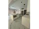 Bright kitchen featuring a large island, marble floors, and a skylight providing ample natural light at 14273 Nugent Circle, Spring Hill, FL 34609