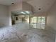 Expansive living room featuring elegant marble floors, lots of natural light, and an open floor plan at 14273 Nugent Circle, Spring Hill, FL 34609