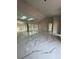 Bright living room showcasing marble floors, high ceilings, and seamless indoor-outdoor flow at 14273 Nugent Circle, Spring Hill, FL 34609