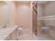 Bright bathroom features a large walk-in shower with a glass door and modern fixtures at 15101 Kestrelglen Way, Lithia, FL 33547