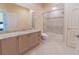 Bathroom featuring a vanity with granite countertop and a shower-tub combination at 15101 Kestrelglen Way, Lithia, FL 33547