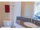 Bathroom with a granite countertop and a view to the pool and patio at 15101 Kestrelglen Way, Lithia, FL 33547