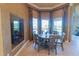 Breakfast nook with beautiful pool views and great natural light at 15101 Kestrelglen Way, Lithia, FL 33547