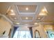 Coffered ceiling with recessed lighting and elegant finishings at 15101 Kestrelglen Way, Lithia, FL 33547
