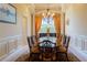Formal dining room with chandelier and decorative curtains at 15101 Kestrelglen Way, Lithia, FL 33547