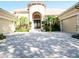 Stunning home featuring a circular driveway, lush landscaping, and a grand entrance with a unique turret feature at 15101 Kestrelglen Way, Lithia, FL 33547