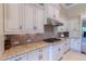 Beautiful kitchen counter with granite countertops, tile backsplash, and stainless steel appliances at 15101 Kestrelglen Way, Lithia, FL 33547