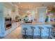 Gourmet kitchen with custom cabinetry, granite counters, stainless appliances, and large center island at 15101 Kestrelglen Way, Lithia, FL 33547